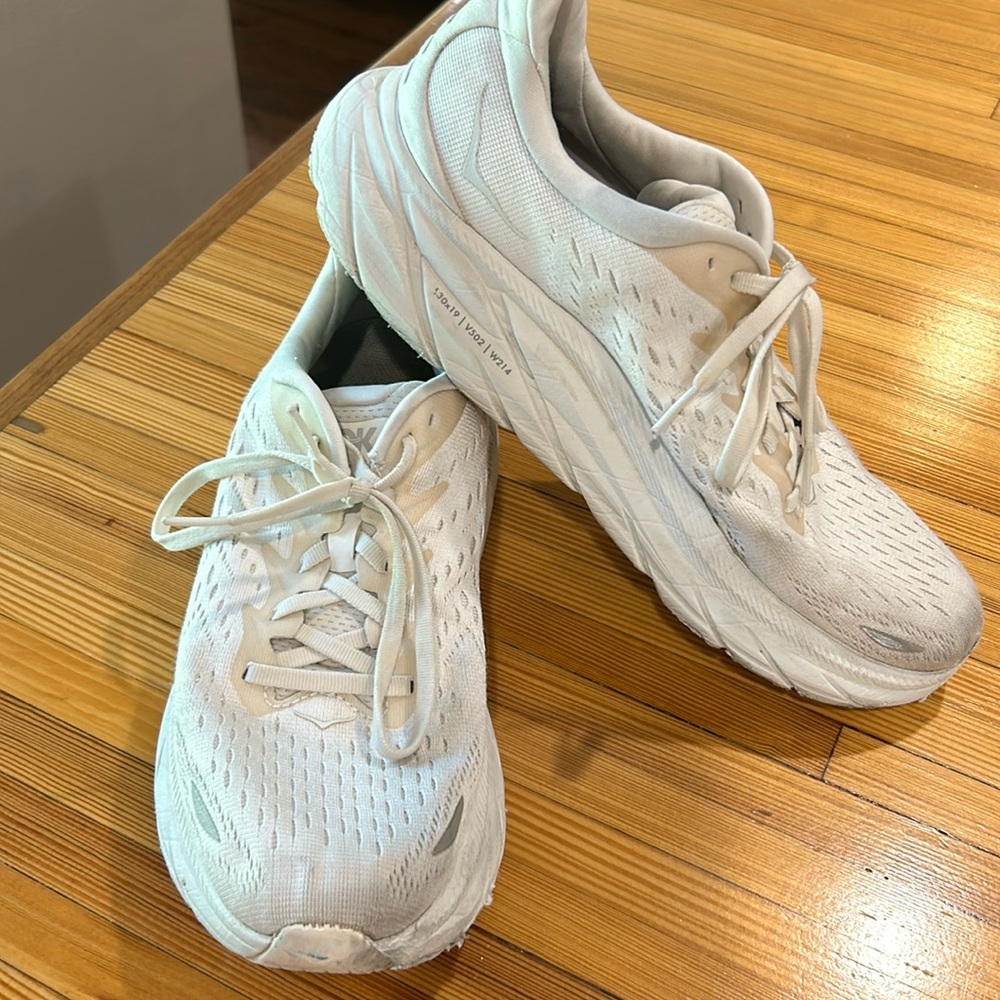 White HOKA running shoes size 10